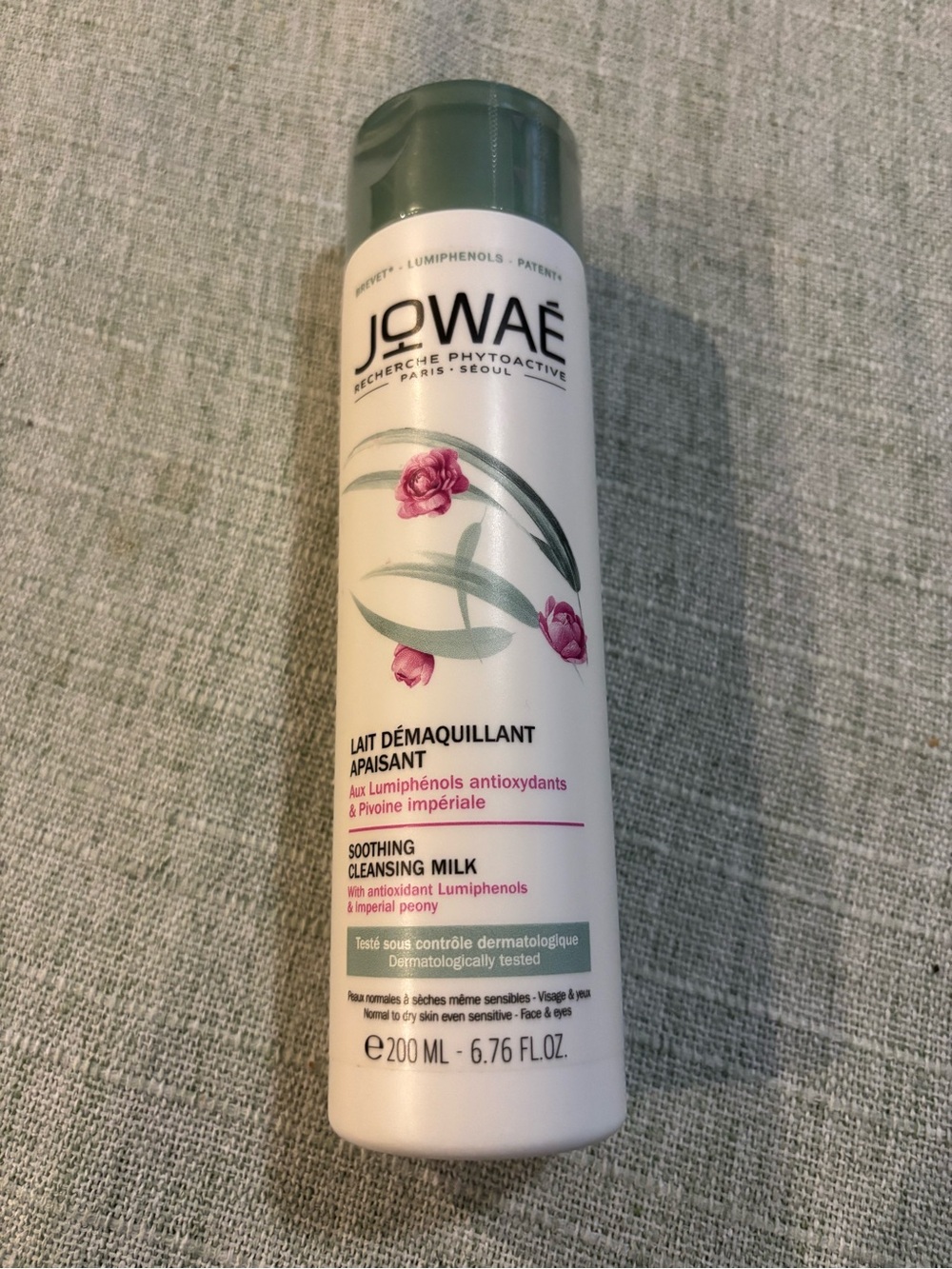 Soothing Cleansing Milk — White with Green & Pink Accents.